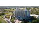 Beautiful exterior view of resort featuring manicured landscaping, golf course, and luxurious design at 7593 Gathering Dr # 203, Reunion, FL 34747
