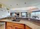 Bright and airy kitchen with granite countertops and bar seating, offering a view into the living area at 7593 Gathering Dr # 203, Reunion, FL 34747