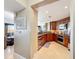 Modern kitchen featuring stainless steel appliances, warm-toned cabinets and granite countertops at 7593 Gathering Dr # 203, Reunion, FL 34747
