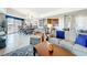 Open-concept living space with a dining area, kitchen, and comfortable seating, perfect for entertaining at 7593 Gathering Dr # 203, Reunion, FL 34747