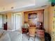 Cozy office area with a built-in wooden desk, a comfortable chair, and ample storage at 7593 Gathering Dr # 203, Reunion, FL 34747