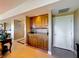 Convenient wet bar with wooden cabinetry, granite countertop, and a sink, ideal for entertaining at 7593 Gathering Dr # 203, Reunion, FL 34747