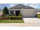 Lovely single-Gathering home with a tidy yard and neutral color palette, creating a welcoming curb appeal at 7838 Penrose Pl, Wildwood, FL 34785