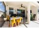 Inviting screened patio with comfortable seating, perfect for outdoor relaxation at 7838 Penrose Pl, Wildwood, FL 34785