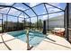 Private screened-in pool with a water feature for tranquil outdoor living at 7838 Penrose Pl, Wildwood, FL 34785