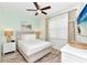 Comfortable bedroom with soft lighting, a ceiling fan, and wood-look flooring at 8199 Coconut Pl, Kissimmee, FL 34747
