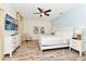 Serene main bedroom with soft lighting, a ceiling fan, and wood-look flooring at 8199 Coconut Pl, Kissimmee, FL 34747