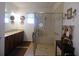 Stylish bathroom with double vanity, glass-enclosed shower, and decorative fixtures for a spa-like experience at 8824 Sw 104Th Cir, Ocala, FL 34481