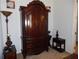 Bedroom features a decorative wardrobe, providing storage and style creating an organized room at 8824 Sw 104Th Cir, Ocala, FL 34481