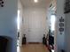 Inviting entryway with neutral walls, ceramic tile floors and decorative decor creating a warm and welcoming ambiance at 8824 Sw 104Th Cir, Ocala, FL 34481