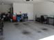 Well-maintained two-car garage, clean and organized for optimal storage and vehicle parking at 8824 Sw 104Th Cir, Ocala, FL 34481
