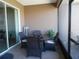 Relaxing lanai with a round dining table and seating for four at 8824 Sw 104Th Cir, Ocala, FL 34481