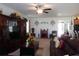 Open living room with comfortable seating, a decorative fireplace, entertainment center and adjacent kitchen at 8824 Sw 104Th Cir, Ocala, FL 34481