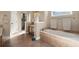 Bathroom with a soaking tub, tiled floors, and a glass-enclosed shower at 437 Wilmington Cir, Oviedo, FL 32765