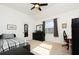 Bedroom with a plaid bed, a desk, and a window at 437 Wilmington Cir, Oviedo, FL 32765