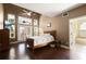 Main bedroom featuring high ceilings, windows, wood floors, and access to ensuite bathroom at 437 Wilmington Cir, Oviedo, FL 32765