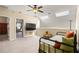 Bedroom with a bed, a ceiling fan, skylights, and carpeted floors at 437 Wilmington Cir, Oviedo, FL 32765