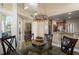 Dining area showing access to kitchen, living area, and views to the outside at 437 Wilmington Cir, Oviedo, FL 32765