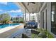 Enclosed patio area with a pool, outdoor kitchen, ceiling fans, and plenty of room for seating at 437 Wilmington Cir, Oviedo, FL 32765