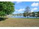 Waterfront property features a tranquil pond reflecting the sky, creating a serene and picturesque setting at 437 Wilmington Cir, Oviedo, FL 32765