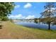 Lakeside view showcasing the serene pond, providing a tranquil atmosphere and complementing the surrounding landscape at 437 Wilmington Cir, Oviedo, FL 32765