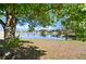 Scenic view of a peaceful pond, reflecting the surrounding trees and sky, adding natural beauty to the property at 437 Wilmington Cir, Oviedo, FL 32765
