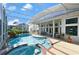 Stunning screened in pool area with a spa, lounge area, and plenty of room for seating at 437 Wilmington Cir, Oviedo, FL 32765