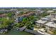 Aerial view featuring condominium community, green spaces, and lake at 100 S Interlachen Ave # 503, Winter Park, FL 32789