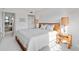 Cozy bedroom featuring white walls, carpet, and light wood bedroom furniture at 100 S Interlachen Ave # 503, Winter Park, FL 32789