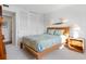 Bedroom featuring white walls, wood bed frame and light colored carpet, with built in closet at 100 S Interlachen Ave # 503, Winter Park, FL 32789