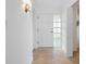 Inviting foyer with tile floors, closet, and entry door, showcasing a bright and welcoming entrance at 100 S Interlachen Ave # 503, Winter Park, FL 32789