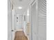 Hallway with natural light featuring white walls and closets, leading to other rooms at 100 S Interlachen Ave # 503, Winter Park, FL 32789