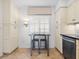 Cozy kitchen featuring breakfast nook with table and chairs, cabinets, and stainless steel dishwasher at 100 S Interlachen Ave # 503, Winter Park, FL 32789