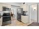 Kitchen features stainless steel appliances, tile flooring, and easy access to the dining room and other rooms at 100 S Interlachen Ave # 503, Winter Park, FL 32789