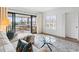 Bright living room features a balcony with seating that offers city views and natural light at 100 S Interlachen Ave # 503, Winter Park, FL 32789