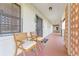 Exterior condo patio with seating and garden views, perfect for enjoying the sunny Florida weather at 100 S Interlachen Ave # 503, Winter Park, FL 32789