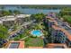 A stunning aerial view of a community pool, putting green, manicured landscaping and parking at 100 S Interlachen Ave # 503, Winter Park, FL 32789