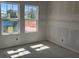 A bright room with exposed framework featuring a large window to let in ample light at 1013 Alabaster Way, Deltona, FL 32725