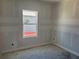 A bedroom with a window at 1013 Alabaster Way, Deltona, FL 32725