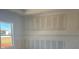 A bedroom under construction with drywall walls, a window with a view, and the potential for customization at 1013 Alabaster Way, Deltona, FL 32725