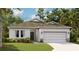 Charming single-story home with a well-manicured lawn and an attached two-car garage, ideal for a growing Gathering at 1013 Alabaster Way, Deltona, FL 32725