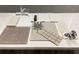 Selection of design materials with tile, carpet, countertops, faucet and cabinet door samples at 1013 Alabaster Way, Deltona, FL 32725