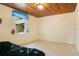 Bedroom with wood ceiling, tile floors, window and closet at 1120 Sheeler Ave, Apopka, FL 32703