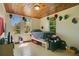Bright bedroom with wood ceiling, tile floors, and natural light from multiple windows at 1120 Sheeler Ave, Apopka, FL 32703