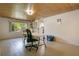 Comfortable living area featuring tiled floors, a tongue and groove ceiling, and natural light at 1120 Sheeler Ave, Apopka, FL 32703