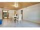 Comfortable living area showcasing tiled floors, a tongue and groove ceiling, and natural light at 1120 Sheeler Ave, Apopka, FL 32703