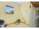 Utility room features a window, tiled flooring, and a hot water heater at 1120 Sheeler Ave, Apopka, FL 32703