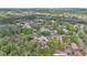 Community aerial view of a suburban area with houses amongst the trees at 122 Spreading Oak Ct, Sanford, FL 32773