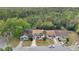 Aerial image shows houses close together surrounded by lush green foliage and manicured lawns at 122 Spreading Oak Ct, Sanford, FL 32773