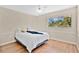 Bedroom featuring wood-look flooring, a ceiling fan, and a large window at 122 Spreading Oak Ct, Sanford, FL 32773